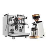 The Profitec Drive Espresso Machine and Eureka Oro Pro Grinder (White) Bundle by Profitec features a stainless steel dual boiler machine with multiple dials and levers, alongside a modern grinder filled with coffee beans, all on a white background.