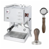 The Quick Mill CYBER BUNDLE includes a stainless steel Pop-up Espresso Machine with PID control, pressure gauge, three buttons, wooden accents, two portafilters, and a wooden-handled tamper.