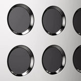 A grid of six round, black buttons with metallic rims, resembling premium espresso machine controls, is arranged in two rows on a light gray background. Ideal for precise temperature control adjustment, the design reflects the elegance of the Rocket Appartamento TCA Espresso Machine.