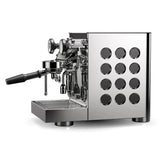 The Rocket Appartamento TCA Espresso Machine with Flow Control RE502A3B12 is a stainless steel, black-finished high-end home espresso machine with pressure gauges, a portafilter, circular side cutouts, and precise temperature control for perfect brews on any countertop.