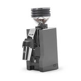 A grey Eureka Mignon Zero 65 All Purpose Grinder by Eureka, shown on a plain white background with a clear hopper of coffee beans. This model is currently backordered.