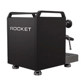The Rocket Mozzafiato Fast Type R Espresso Machine RE852E3B12 (Black) by Rocket features raised "ROCKET" metal letters, an OLED display, metal feet, and visible portafilter and steam wand in a sleek side view.