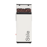 The Rancilio Stile SD Espresso Coffee Grinder (White) by Rancilio features a transparent bean compartment for precise grinding and "Stile" printed vertically on the front.
