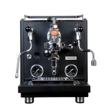 A black Profitec Drive Dual Boiler Espresso Machine with E61 group head, PID temperature control, and flow control is pictured on a white background, featuring pressure gauges, steam and hot water wands, and a portafilter.