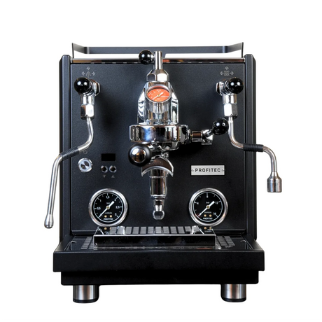 A black Profitec Drive Dual Boiler Espresso Machine with E61 group head, PID temperature control, and flow control is pictured on a white background, featuring pressure gauges, steam and hot water wands, and a portafilter.