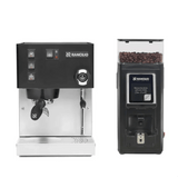 The Rancilio Silvia M V6 Espresso Machine (Limited Edition Black and Stainless Steel) and the Rancilio Stile SD Grinder, both by Rancilio, are displayed side by side against a white background. The grinder is filled with coffee beans.