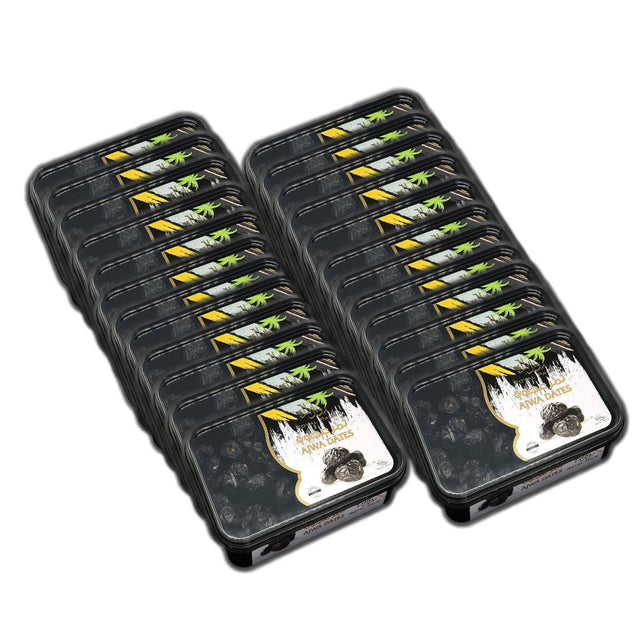 Image shows multiple packs of fresh dates arranged in two neat stacks. The black packaging features a label with yellow and green accents, displaying the name "Royal Palm" along with an image of Royal Palm Al Madina Ajwa premium quality dates and a palm tree. These dates are rich in fiber and potassium for your health.