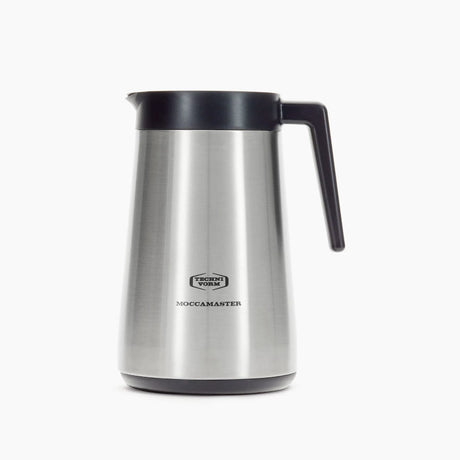 A Technivorm Moccamaster 1.25L Thermal Carafe 59865, featuring a silver body with a black handle and lid, is shown on a white background. The thermal carafe boasts a sleek, cylindrical design with a polished finish and the brand name "Moccamaster" printed on the front.