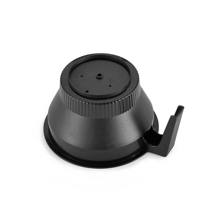 The Technivorm Moccamaster CD Grand & CDT Grand Non-Adjustable Brew Basket 13271 features a black plastic base and grinding mechanism. The circular base, made from BPA-free plastics, includes a ribbed ring near the top and a hook protruding from the side. The bottom surface has a smooth finish, designed to attach seamlessly to the main grinder body of the Moccamaster.