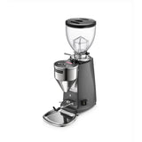 The Mazzer Mini Type A V2 Electronic Grinder by Mazzer in dark grey features flat burrs, a clear bean hopper, front digital controls, a dispensing spout, and a metal base tray.
