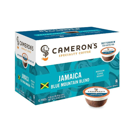 A box of Cameron's Jamaica Blue Mountain Single-Serve Coffee Eco Pods, presented in blue and white packaging adorned with the Jamaican flag. The box includes 12 medium dark roast eco coffee pods made from Central American beans, with one compostable single-serve pod displayed in front.