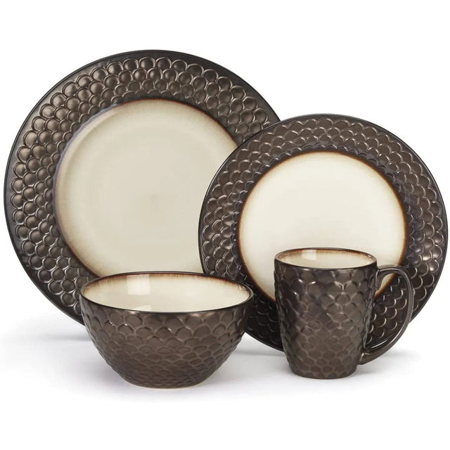 The Cuisinart 16 Piece Dinnerware Set (CDST1-S4G1C) by Cuisinart features a matching 4-piece set that includes a large dinner plate, a smaller salad plate, a bowl, and a mug. Crafted from Anais glazed stoneware, each piece boasts textured dark brown exteriors resembling scales and smooth, light cream interiors with a gradient brown edge.