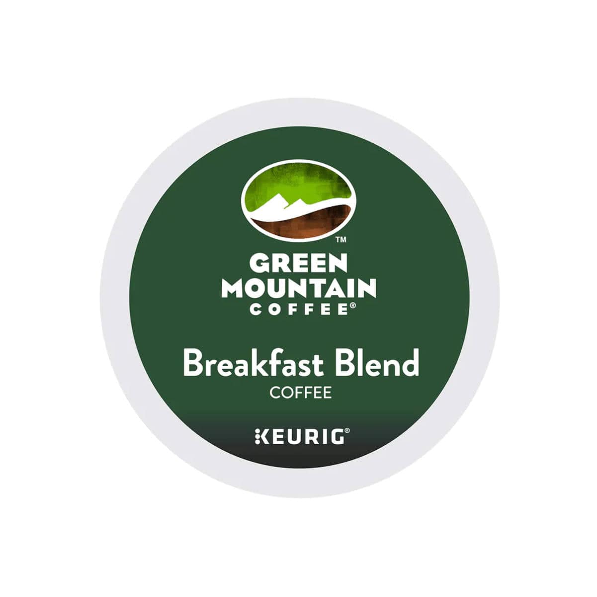 Circular label for Green Mountain's Breakfast Blend, featuring a white background and dark green center. The upper part displays a small graphic of mountains. The text at the top reads "Green Mountain Coffee," while the middle section states "Breakfast Blend Coffee" with nutty tasting notes, and the bottom indicates "Keurig K-Cup® Recyclable Pods.