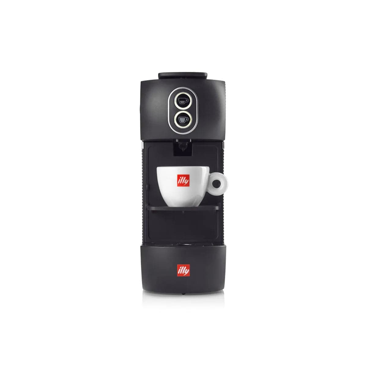 A black Illy Coffee Machine with E.S.E. pods (Illy ESE) has a small white ceramic cup positioned under the coffee spout. Both the cup and machine feature the Illy logo in red. The machine is compatible with illy E.S.E. pods and has two round buttons on the top front panel.