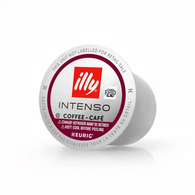 The Illy Intenso Dark Roast K-Cup® Pod (Case of 60) features the iconic Illy logo and instructions in both English and French. The white pod advises allowing it to cool before peeling. This Dark Roast Arabica coffee pod is not intended for retail sale and is compatible with Keurig K-Cup® Pods.