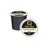 A single-serve K-Cup® Pod from Peet's Coffee, labeled "Major Dickason's Blend," lies on its side with another pod standing upright behind it. This dark roast, Peet's bestselling coffee, described as "Rich, Complex, Full-Bodied," displays the Keurig logo for compatibility.
