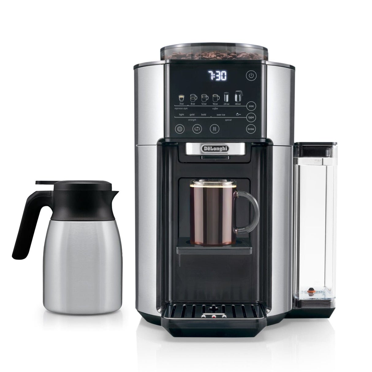 The DeLonghi TrueBrew Fully Automatic Drip Coffee Machine CAM51035M in stainless steel with a thermal carafe showcases a modern, sleek design. Its digital display reads "7:30" while brewing a mug of single-serve drip coffee. To the left of the machine sits the stainless steel carafe. The device features various buttons and a transparent water reservoir on its side.