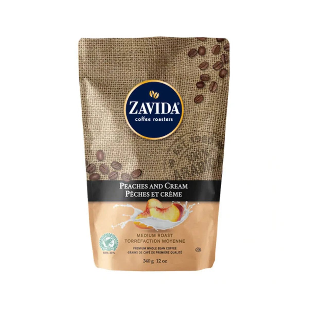 A 12 oz bag of Zavida Peaches and Cream Whole Bean Coffee. The upper portion showcases a burlap-textured design with coffee bean graphics alongside the Zavida logo, while the lower portion features a cream and peach illustration that highlights the flavor theme. The text is presented in both English and French.