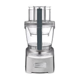 The Cuisinart® Elite Collection® 14-Cup (3.5 L) Food Processor FP-14DCNC features a modern and sleek stainless steel design with a transparent work bowl and lid. It boasts a high-performance 14-cup capacity, complete with an adjustable slicing disc. The silver base is equipped with a control panel that includes buttons labeled "On," "Off," "Dough," and "Pulse." The brand name "Cuisinart" is prominently embossed on the front.